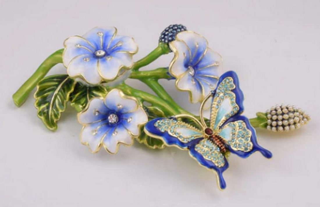 Blue Butterfly on Bloomed Flowers: Blue Butterfly on Bloomed Flowers Butterflies are rich in symbolism across cultures: they represent transformation and rebirth, the human soul, love and marital bliss, joy and beauty, and