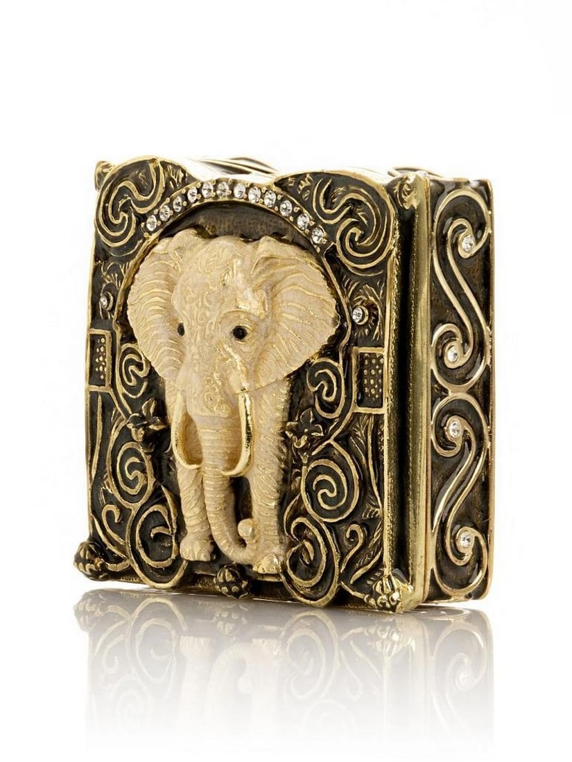 Majestic Brown and Gold Elephant Trinket Box: Majestic Brown and Gold Elephant Trinket Box This charming trinket box captures the grandeur and elegance of elephants, symbolizing wisdom, strength, and good fortune. The piece is hand-painted in ric