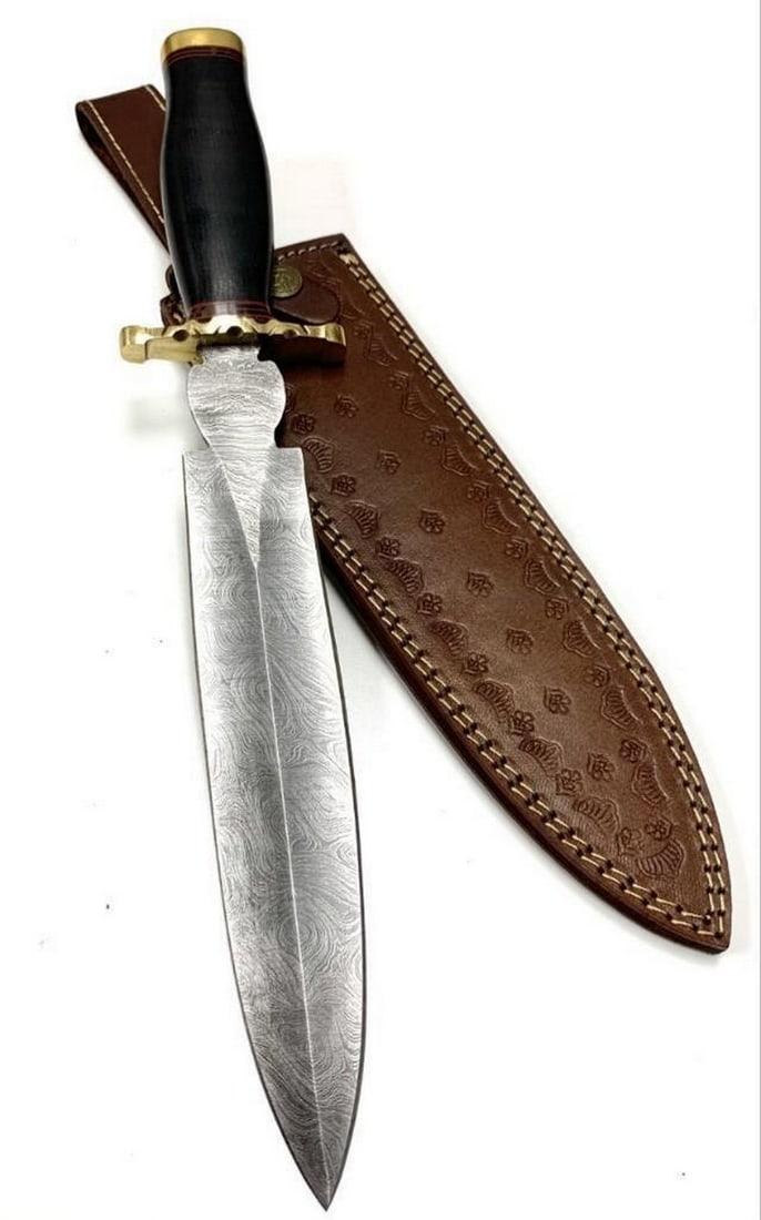 Large Spear Point Damascus Hunting Blade With Leather Sheath: Large Spear Point Damascus Hunting Blade With Leather Sheath Damascus Steel Blade with 256 Layers on it. HARDNESS 56-60 H R C VERY HIGH QUALITY GENUINE LEATHER SHEATH SIZE: Overall Length: 15.5"