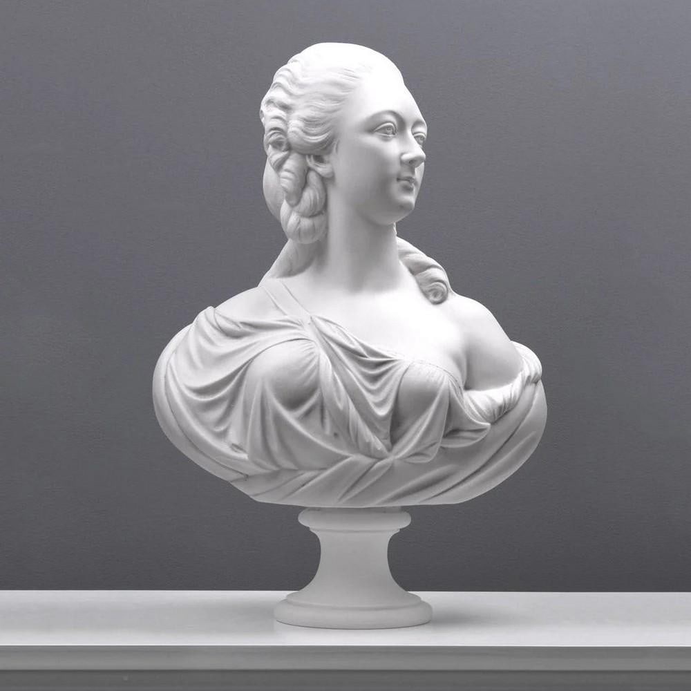 Madame du Barry Bust Sculpture - (30.8lbs): Madame du Barry Bust Sculpture - (30.8lbs) This exquisite bust captures Madame du Barry, the famed mistress of Louis XV, inspired by Augustin Pajou's 1773 masterpiece now housed in the Louvre. Crafted