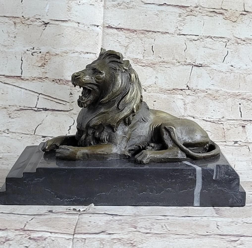 Resting Lion Inspired Bronze Sculpture by Barye - 6'' x 10.5'': Resting Lion Inspired Bronze Sculpture by Barye - 6" x 10.5" This striking bronze sculpture by Barye captures the raw power and majesty of a resting lion, symbolizing untamed strength and determ