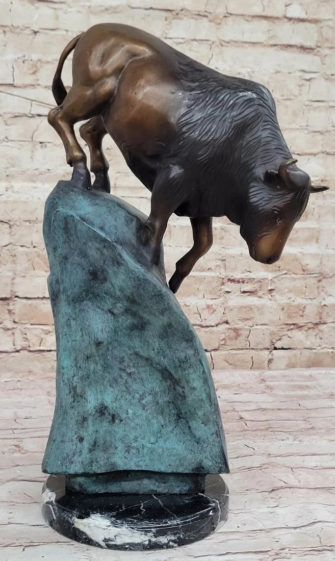 Water Buffalo Standing on Cliff Face Original Bronze Statue - 19'' x 12'': Water Buffalo Standing on Cliff Face Original Bronze Statue - 19" x 12" Experience the wild majesty of the bison with this signed, limited-edition bronze sculpture by Marius. Handcrafted with me