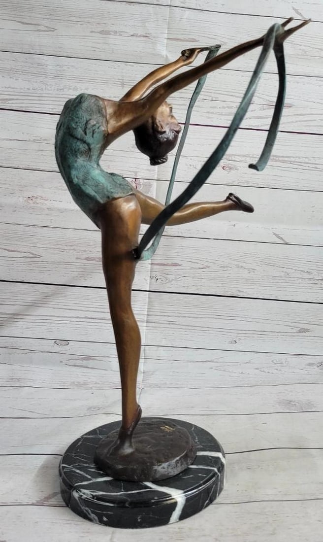 Graceful Dancer in Motion Original Bronze Sculpture by Collett - 21.5'' x 14'': Graceful Dancer in Motion Original Bronze Sculpture by Collett - 21.5" x 14" This exquisite bronze sculpture captures the essence of a graceful dancer in the midst of her performance. With her h