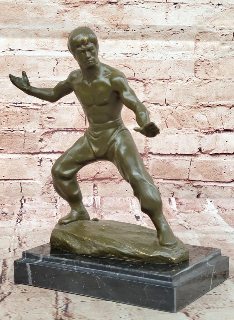 Bruce Lee in Fighting Stance Original Bronze Statue - 10'' x 7'': Bruce Lee in Fighting Stance Original Bronze Statue Honor the legacy of a true cultural icon with this limited edition Star of the Century Bruce Lee bronze sculpture by artist Mavchi. Captured in a dy