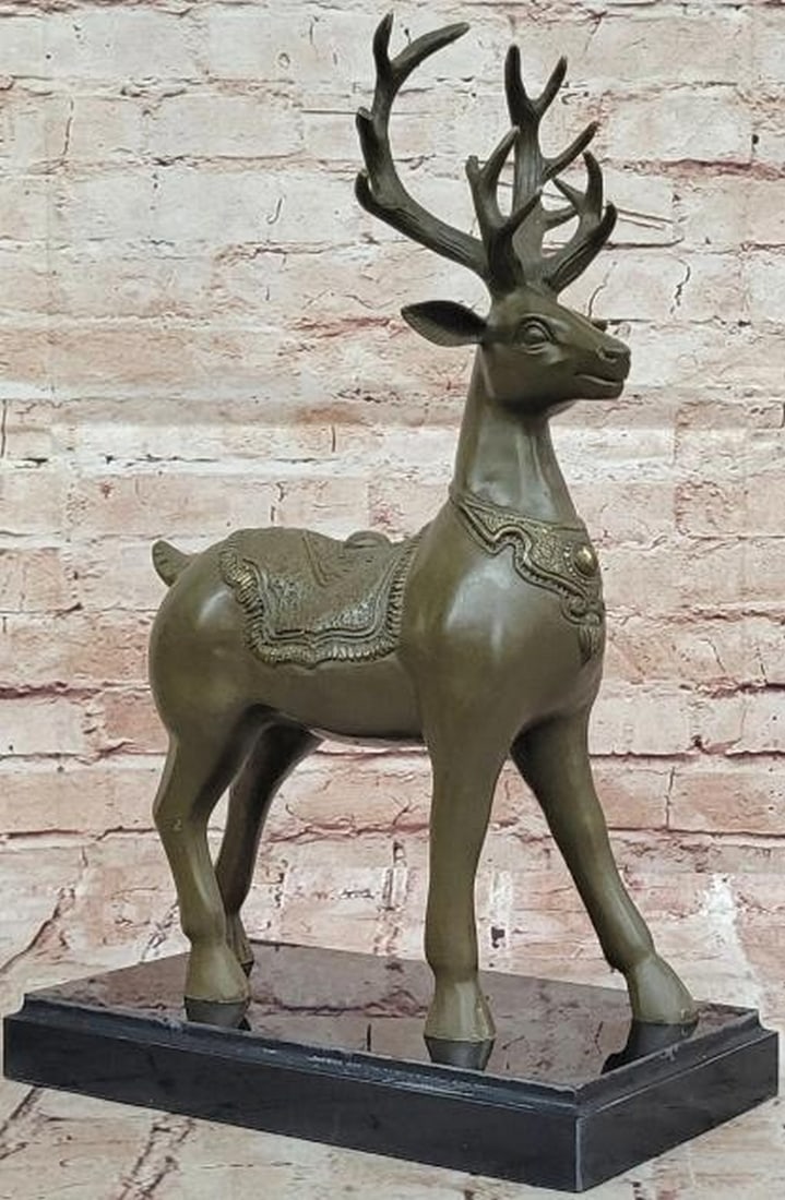 Regal Elegance: Bronze Deer with Antlers Reproduction Statue: Regal Elegance: Bronze Deer with Antlers Reproduction Statue This exquisite bronze reproduction statue captures a majestic deer standing tall with proud antlers, embodying grace and nobility. Adorning