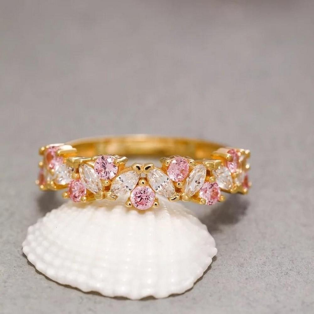 14K Solid Gold Ring with Pink Cubic Zirconia: 14K Solid Gold Ring with Pink Cubic Zirconia Indulge in the captivating allure of our 14K Solid Gold Ring featuring a stunning Pink Cubic Zirconia. Crafted with meticulous precision, this ring exudes 