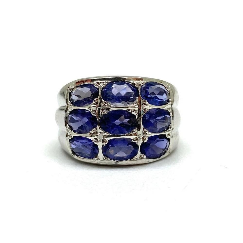 925 Sterling Silver Thick Band with 9 Iolite Gemstones: 925 Sterling Silver Thick Band with 9 Iolite Gemstones. Spiritually, iolite meanings are rather significant. The stone is known as the Vikings Compass and carries the spirit of journey, dreams, intuit