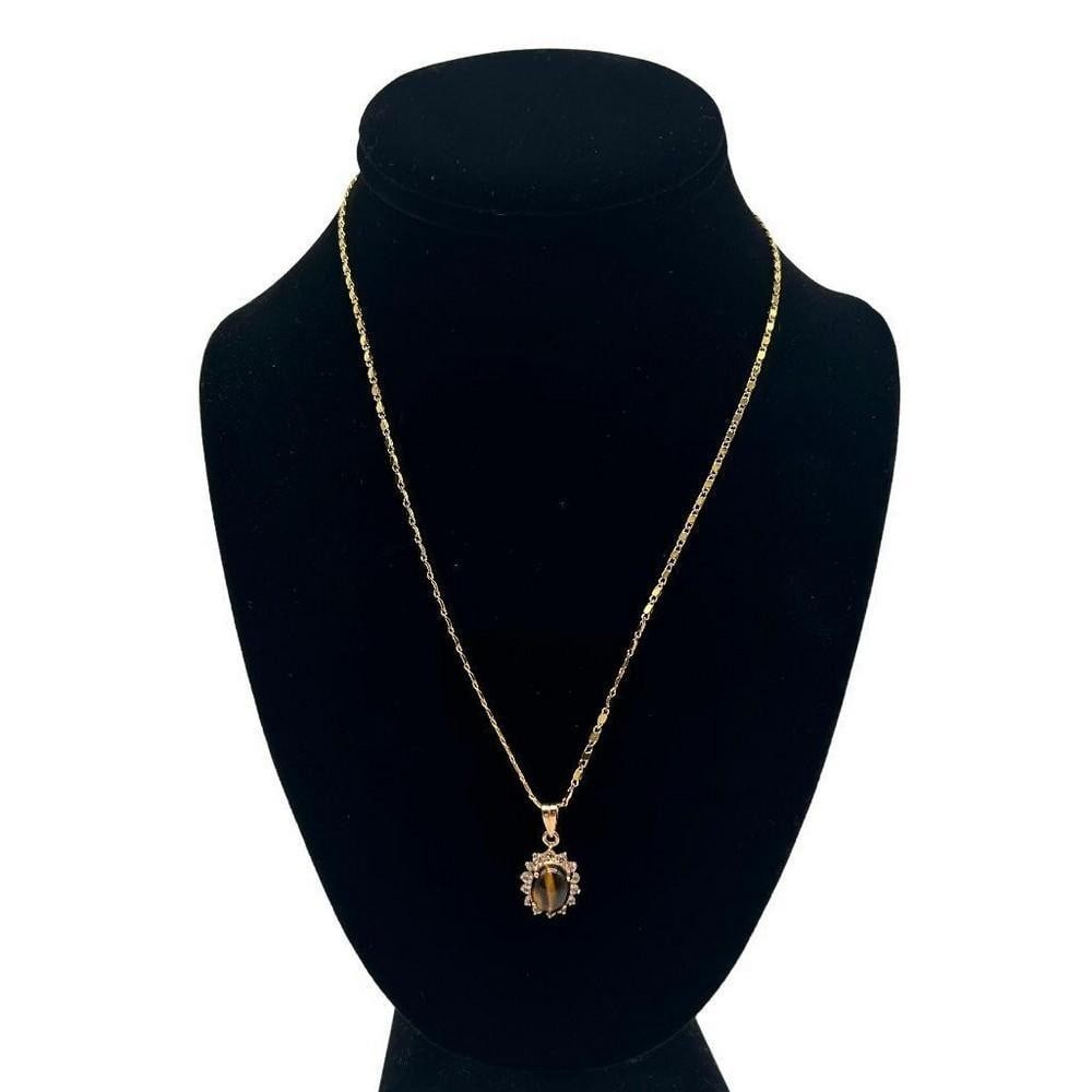 Tiger's Eye Center Stone CZ Pendant Necklace: Tiger s Eye Center Stone CZ Pendant Necklace This pendant combines the brilliance of cubic zirconia (CZ) stones with the natural beauty of a tiger s eye centerpiece, creating a truly mesmerizing