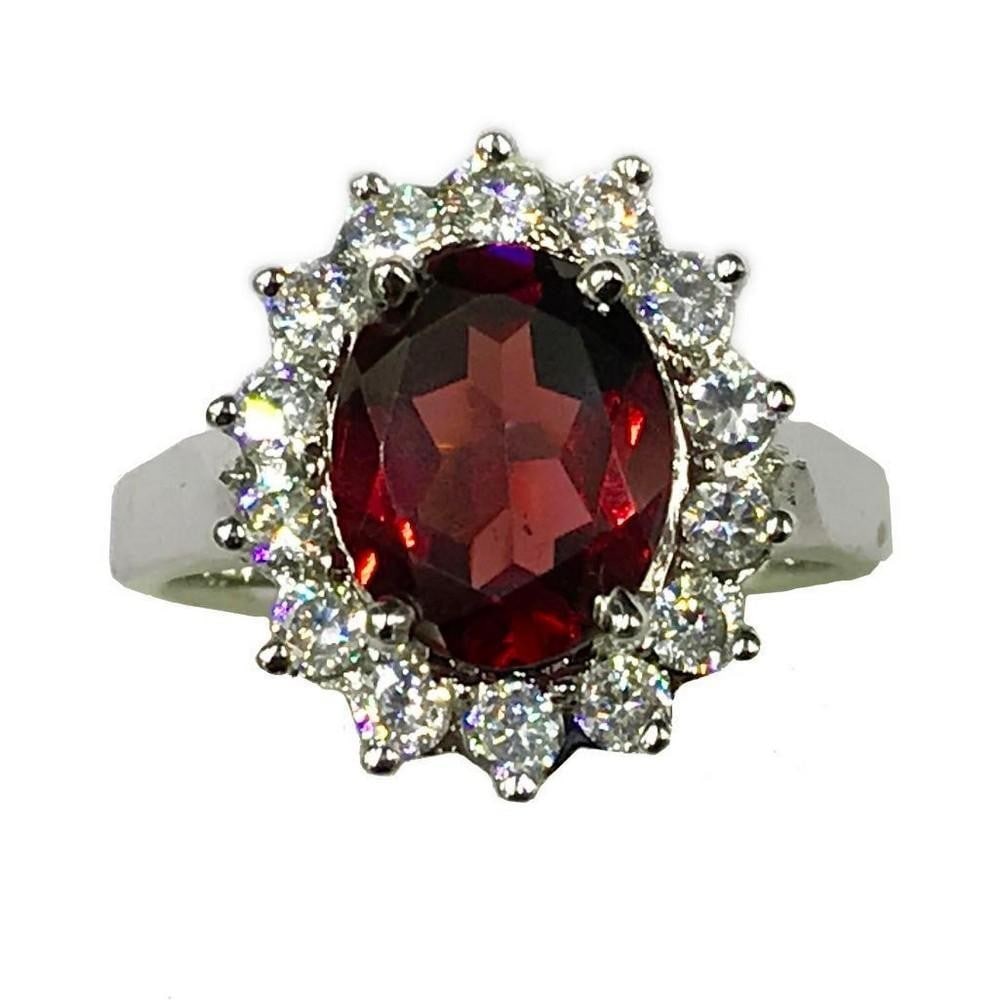 Sterling Silver Flower Garnet Stone Ring: Sterling Silver Flower Garnet Stone Ring This ring is studded with zirconias and a beautiful garnet gemstone. Inner Diameter: 17.25mm View Photos For Further Details.