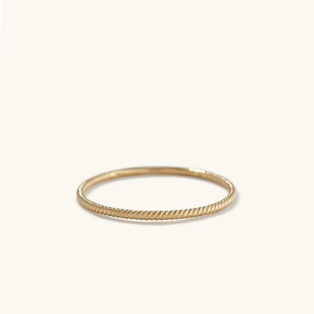 Golden Spiral Elegance Ring: Golden spiral elegance ring made from 14k gold. Embrace timeless sophistication with this ring. Crafted from 14k gold, this stunning piece features a delicate twist design, symbolizing unity and