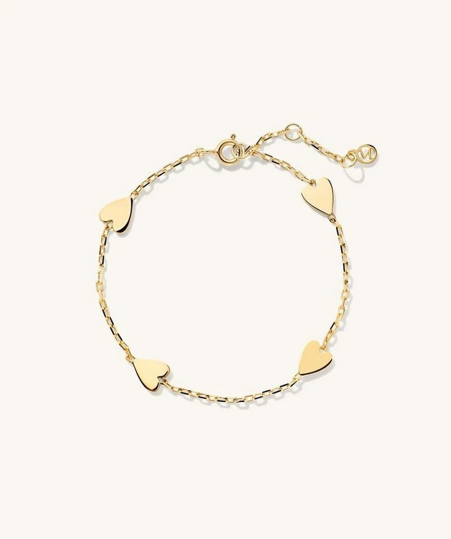 Heartstrings of Gold: Heartstrings of Gold. Delicate and timeless, this bracelet features gold heart pendants that sway gracefully on a sleek chain. A symbol of love and elegance, it's the perfect piece for everyday wear