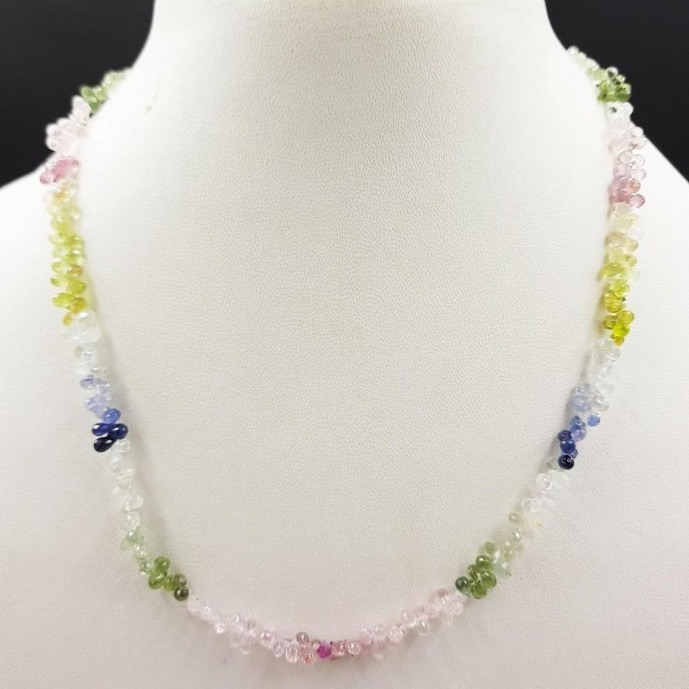 64.94ct Multi-Color Faceted Sapphire Stone Necklace: 64.94ct Multi-Color Faceted Sapphire Stone Necklace Beads Diameter - 3.5 x 2.7mm Length Of Necklace - 40cms Weight In Carats - 64.94ct View Photos for Further Details.