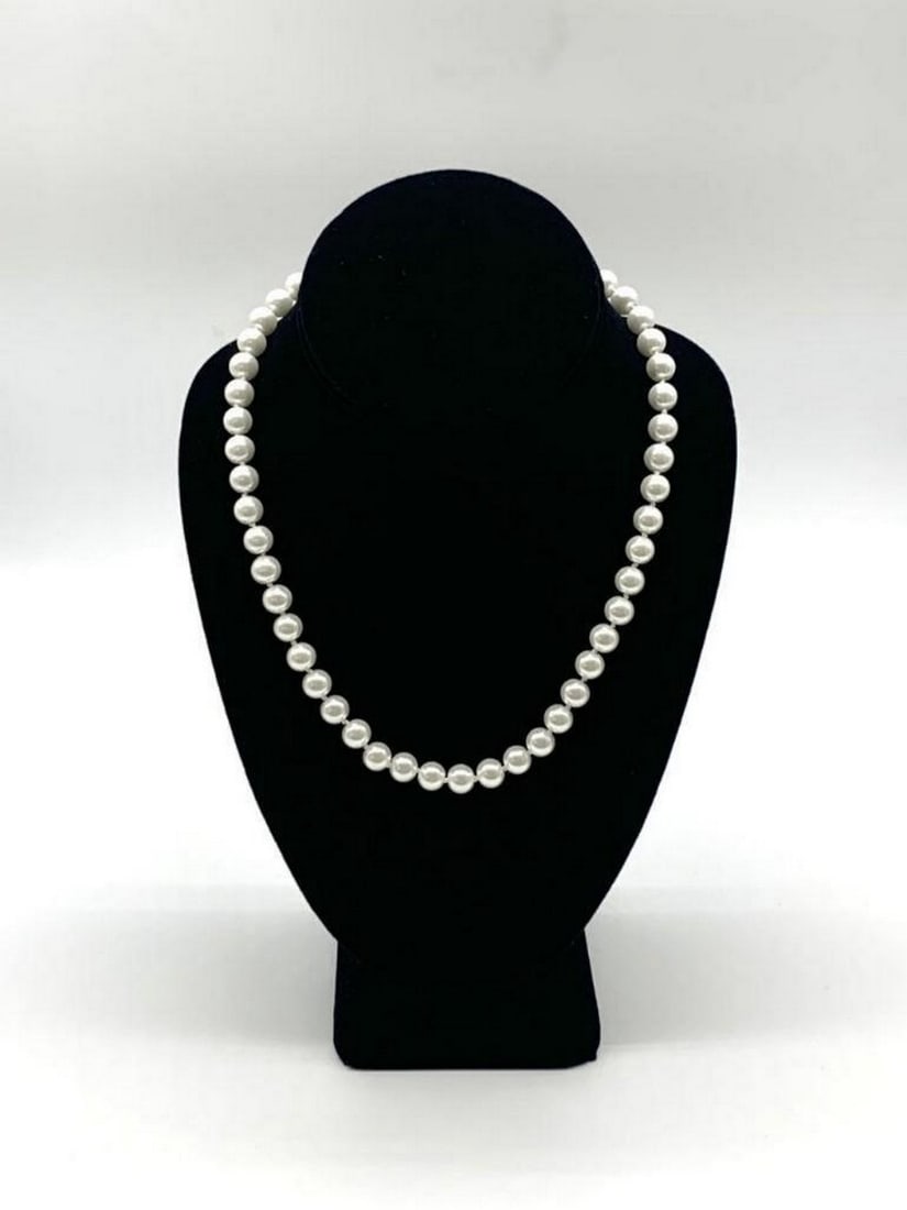Elegant Pearl Necklace and Earrings Set: Elegant Pearl Necklace and Earrings Set View Photos for Further Details.