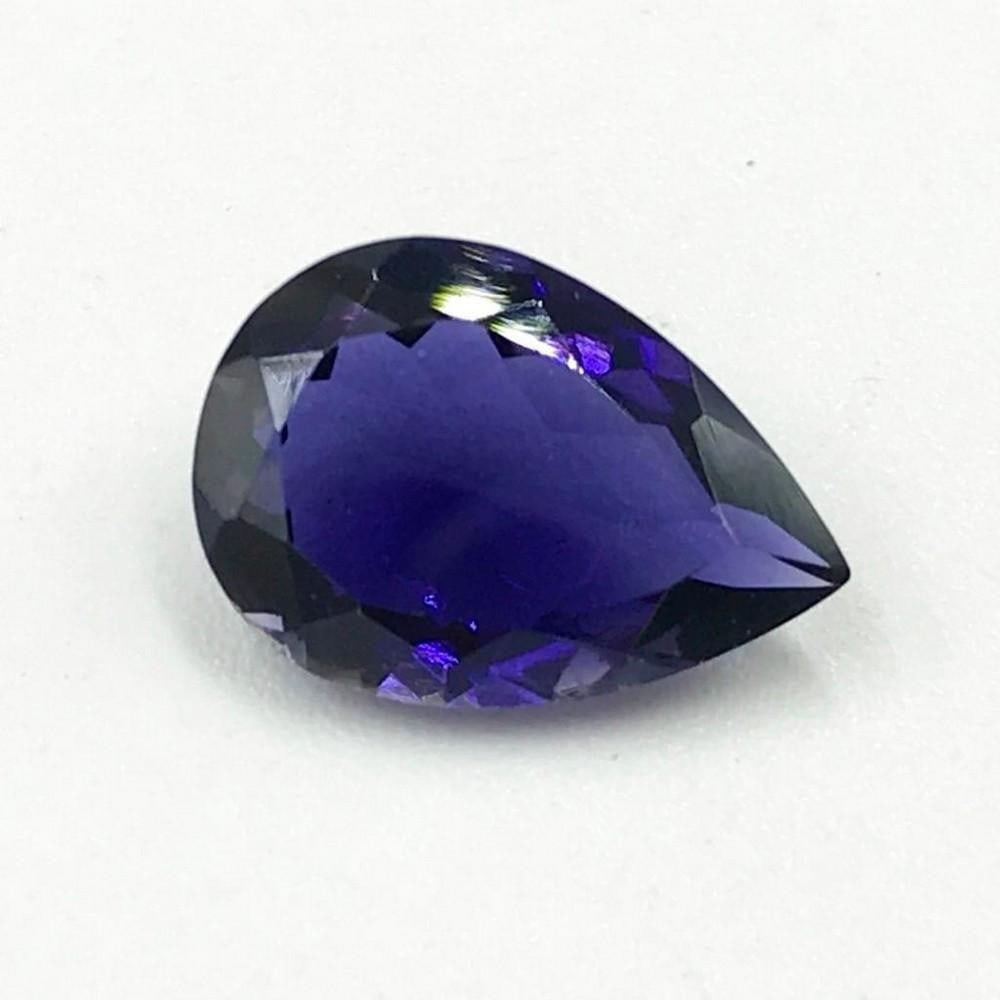Iolite Pear Shaped Faceted Gem: Iolite Pear Shaped Large Size Clean Piece Size: 14 x 10 mm Weight In Carats: 3.52 View Photos For Further Details.
