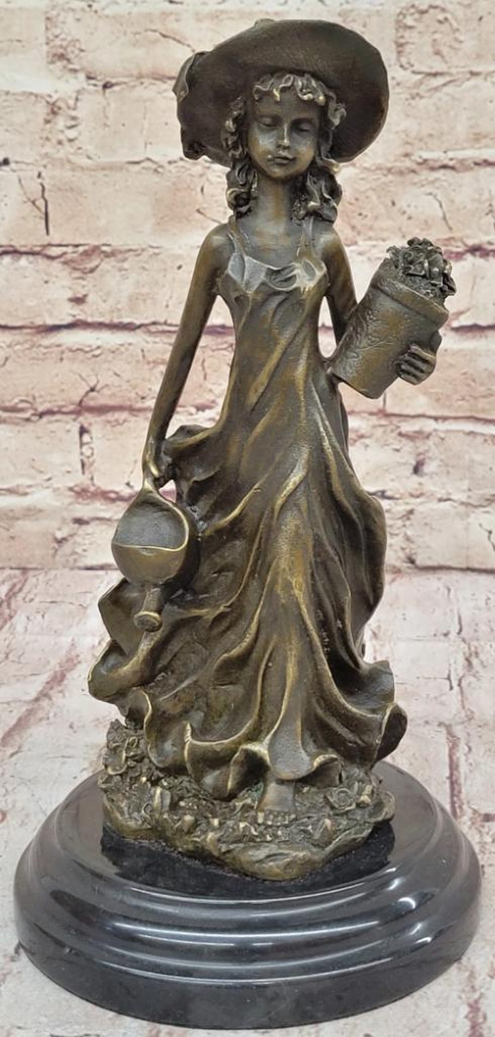 19th Century Girl Wearing Sun Hat Original Bronze Statue - 10.5'' x 5.5'': 19th Century Girl Wearing Sun Hat Original Bronze Statue - 10.5" x 5.5" This serene bronze sculpture by Jean Patoue captures a young girl tending to her garden, evoking innocence and tranquility
