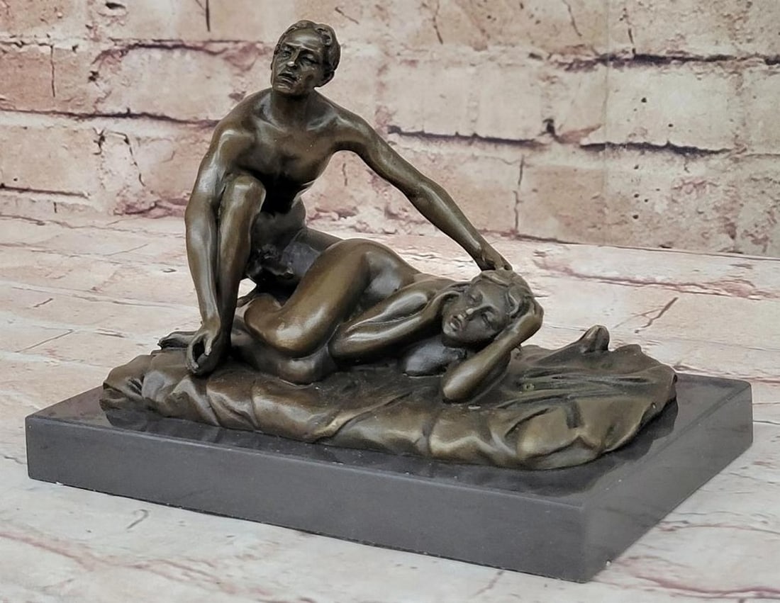 Intimate Couple Bronze Sculpture - 6'' x 7'': Intimate Couple Bronze Sculpture - 6" x 7" This captivating bronze sculpture depicts a young couple in a tender and intimate embrace, celebrating the connection and affection between two figures