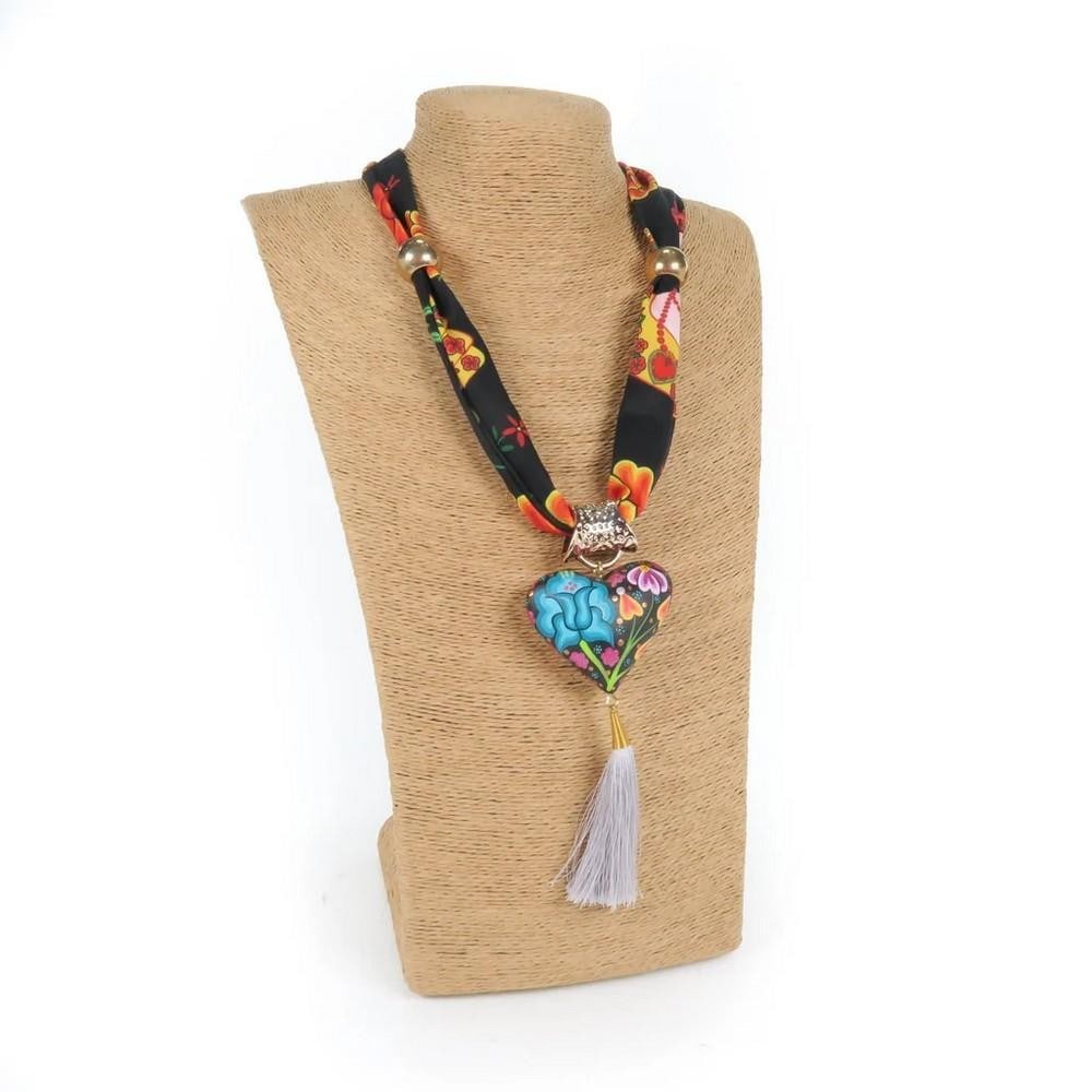 Oaxacan Alebrije Wood Carving Heart & Flowers Necklace: Oaxacan Alebrije Wood Carving Heart & Flowers Necklace Gorgeous heart-shaped necklace handcrafted from locally sourced copal wood and painted with vibrant floral designs and traditional Zapotec