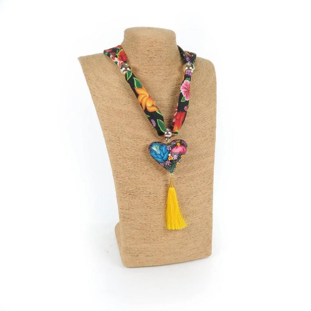 Oaxacan Alebrije Wood Carving Heart & Flowers Necklace: Oaxacan Alebrije Wood Carving Heart & Flowers Necklace Beautiful heart-shaped necklace handcrafted from locally sourced copal wood, adorned with vibrant floral designs and traditional Zapotec patterns