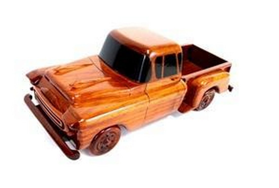 1957 Chevy Stepside Truck: 1957 Chevy Stepside Truck The classic 1957 Chevy Stepside Truck is wonderfully replicated in this solid mahogany scale model. Movable wheels, finely detailed molding and front grill along with air