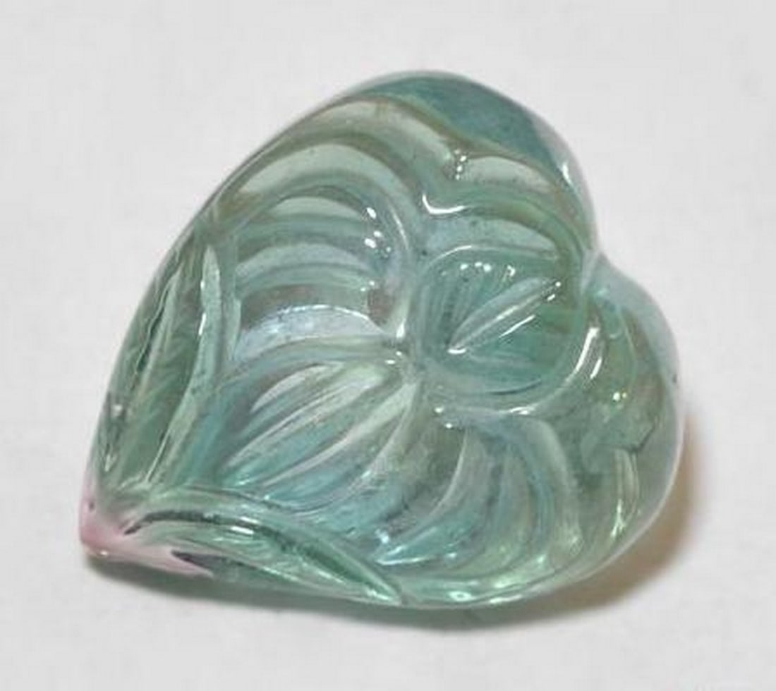 7.6ct Carved Flower Graying Green Loose Green Tourmaline Gemstone: 7.6ct Carved Flower Graying Green Loose Green Tourmaline Gemstone Discover the essence of sophistication with the 7.6ct Carved Flower Graying Green Loose Green Tourmaline Gemstone. Unveiling a