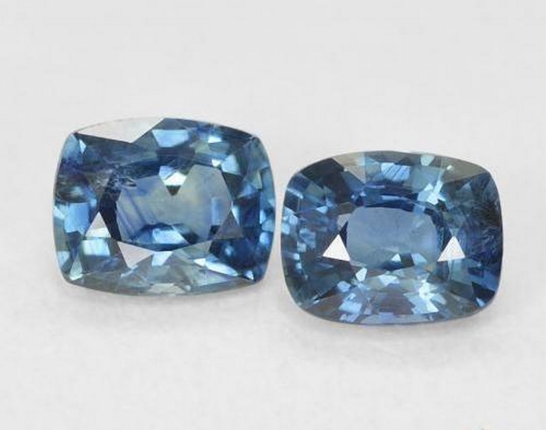 1.15 ct Natural Teal Sapphire, Cushion Cut, VS, Madagascar: 1.15 ct Natural Teal Sapphire, Cushion Cut, VS, Madagascar Pair of natural sapphire gemstones with a total weight of 1.15 ct (average 0.58 ct each), cut in cushion facet shape with a teal color. Each 