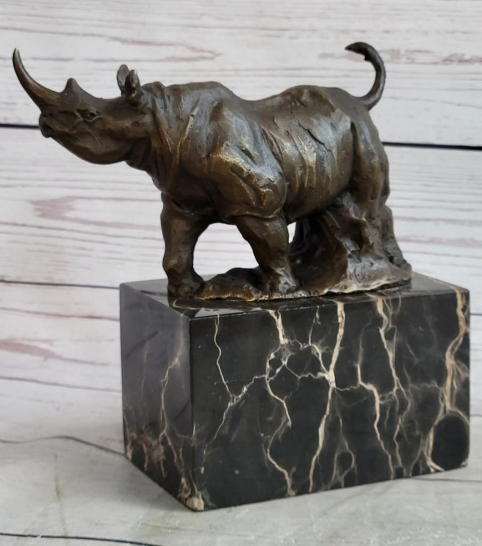 Majestic Rhino Original Bronze Sculpture Signed by Milo - 7.5" x 8.5": Majestic Rhino Original Bronze Sculpture Signed by Milo - 7.5" x 8.5" Experience the commanding presence of the rhinoceros with this captivating bronze sculpture by Milo. This remarkable artwo