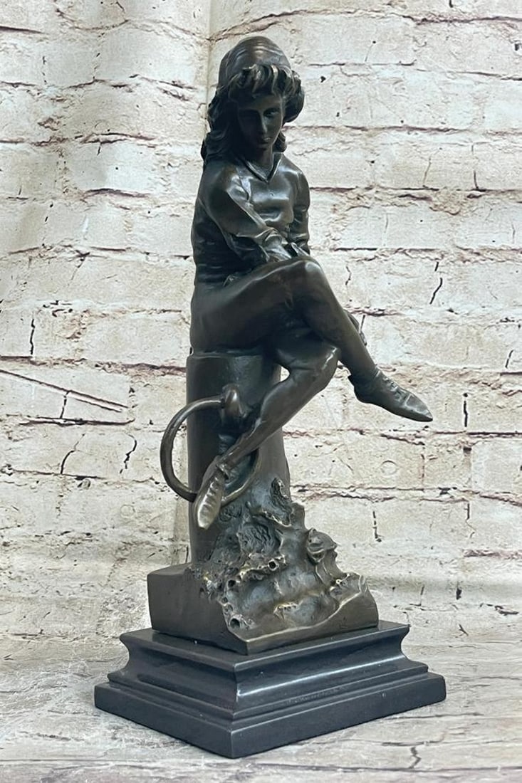 Young Girl Reading Book Bronze Sculpture - 14" x 5": Young Girl Reading Book Bronze Sculpture - 14" x 5" The young girl ca be envisioned sitting with legs crossed on the mooring bollard upon a dock of a seaport. She sits arranging a string tied 