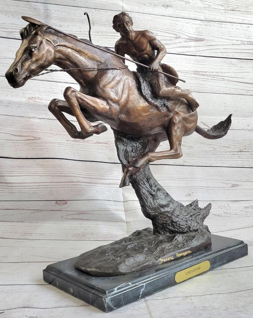 Remington Inspired Native American On Horseback Bronze Sculpture - 17" x 19": Remington Inspired Native American On Horseback Bronze Sculpture - 17" x 19" A native American Indian gallops across the desert with his horse. Armed with a spear, he leans into his