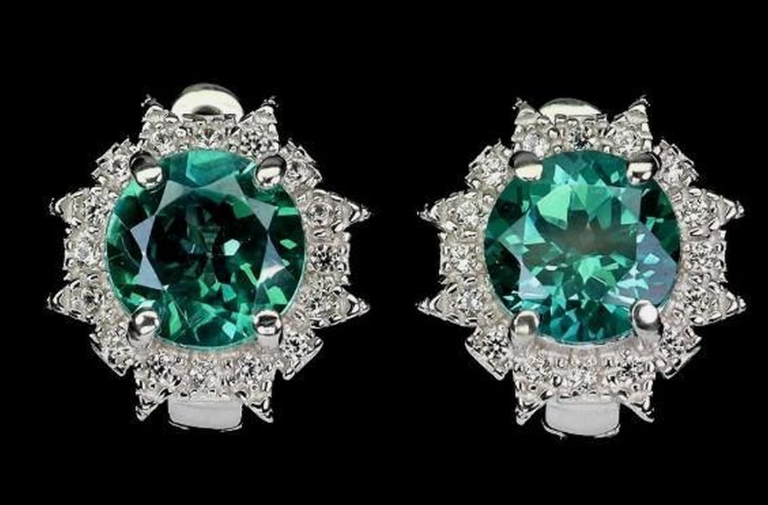 Vibrant Green Topaz Sterling Silver Earrings: Vibrant Green Topaz Sterling Silver Earrings These 925 sterling silver earrings feature 7mm round natural green topaz gemstones, admired for their vibrant, refreshing hue and sparkling clarity. The