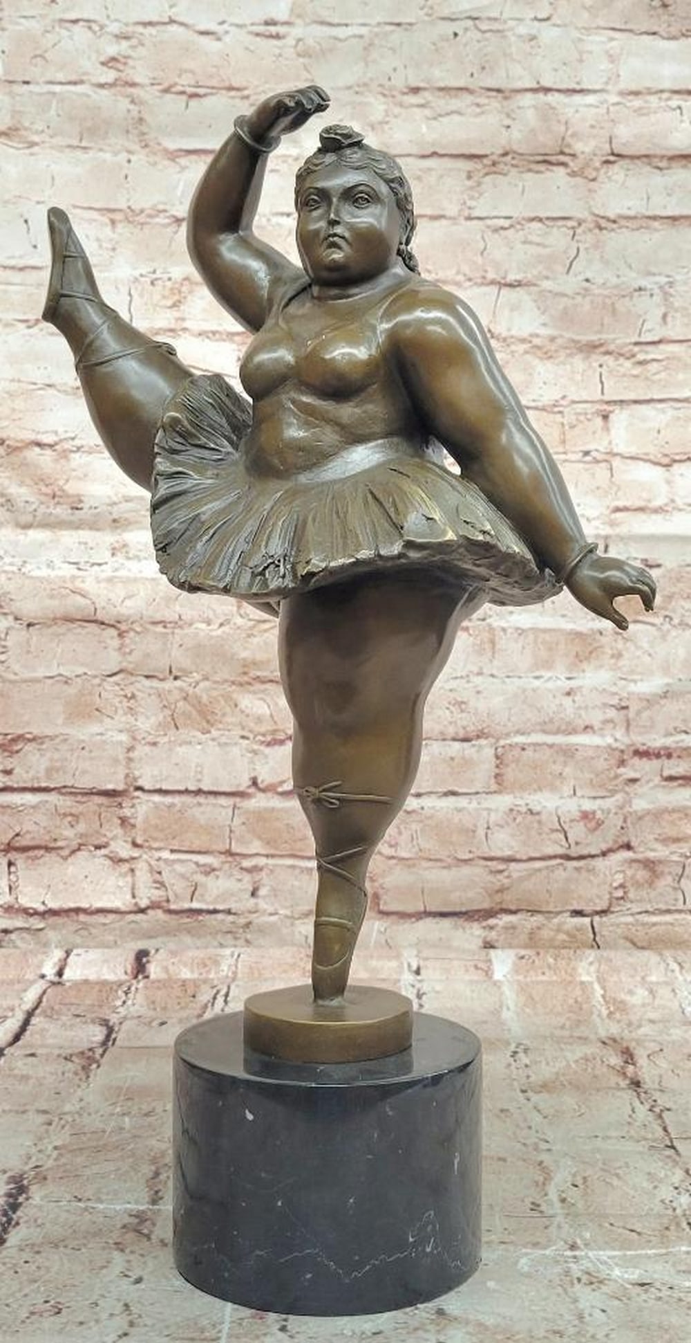 Poised Ballerina" Bronze Sculpture by Fernando Botero – 18" x 11: "Poised Ballerina" Bronze Sculpture by Fernando Botero – 18" x 11" This bronze sculpture by Fernando Botero depicts a ballerina in a graceful pose, with one leg lifted, celebrating b