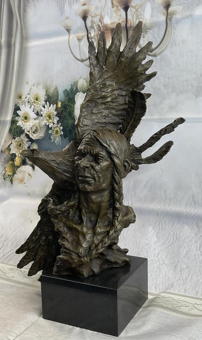 Eagle & Native American Chief Bust Bronze Sculpture- 26" x 25": Eagle & Native American Chief Bust Bronze Sculpture- 26" x 25" This stunning bronze sculpture depicts a Native American shaman, or medicine man, gazing off into the distance while leaning 