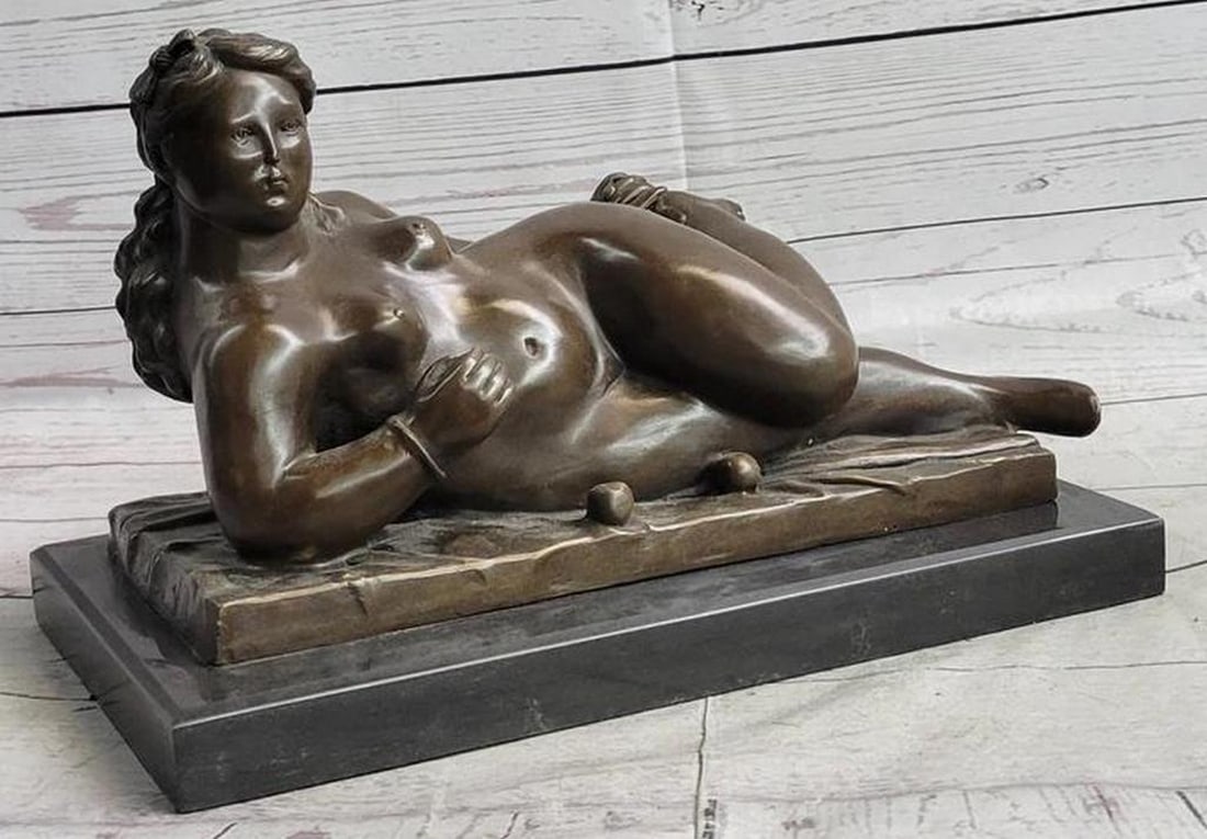 Fernando Botero's Graceful Muse Reproduction Bronze Sculpture of a Reclining Nude Woman: Fernando Botero's Graceful Muse Reproduction Bronze Sculpture of a Reclining Nude Woman - 8.5" x 13" Step into the world of artistic elegance with "Fernando Botero's Graceful Muse,