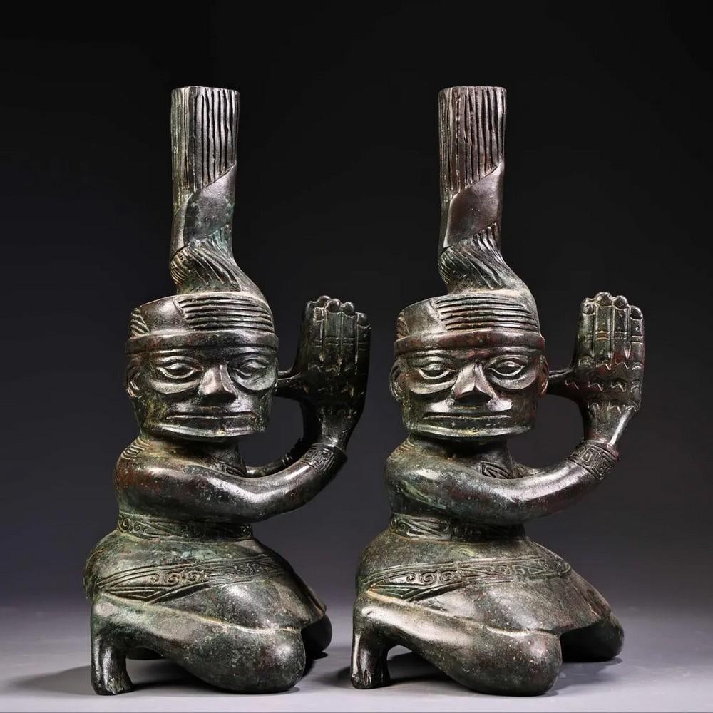 A Pair of Antique Chinese Handcrafted Bronze Kneeling Figures: A Pair of Antique Chinese Handcrafted Bronze Kneeling Figures This finely crafted pair of Chinese antique bronze kneeling figures demonstrates exquisite artistry and delicate detailing. Rare and elega