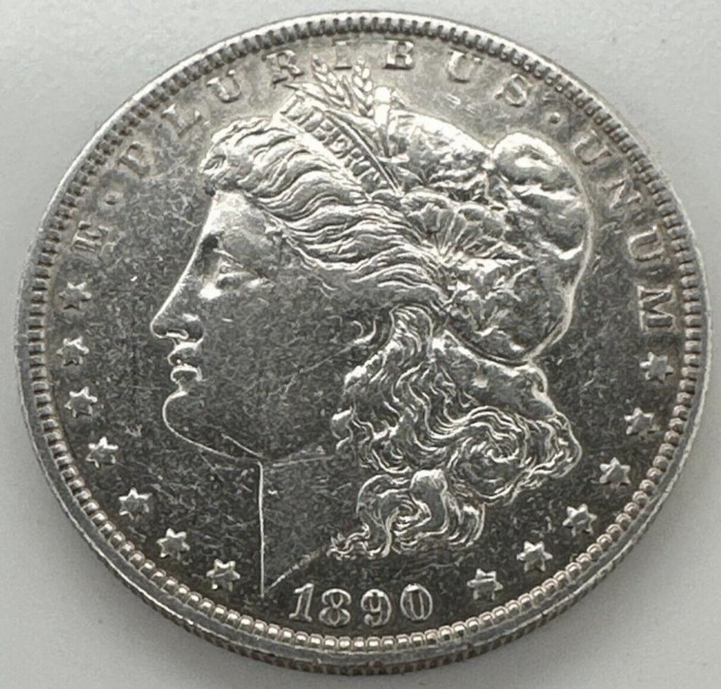 1890-O Morgan One Dollar $1 Silver Coin: 1890-O MORGAN ONE DOLLAR $1 SILVER COIN Certification: Uncertified Circulated/Uncirculated: NA Year: 1890 Composition: 900 Silver Mint Location: New Orleans