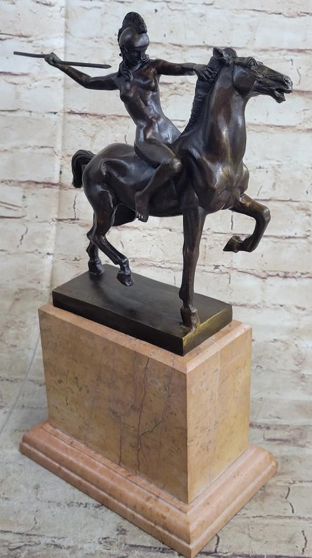 Amazon Female Warrior on Horseback Hippolyta Bronze Statue Sculpture 15.5" x 10": This 100% bronze representation shows a nude woman riding freely across the forest. Without a second thought or care in the world, the woman lets herself go free by keeping nothing from the past with 