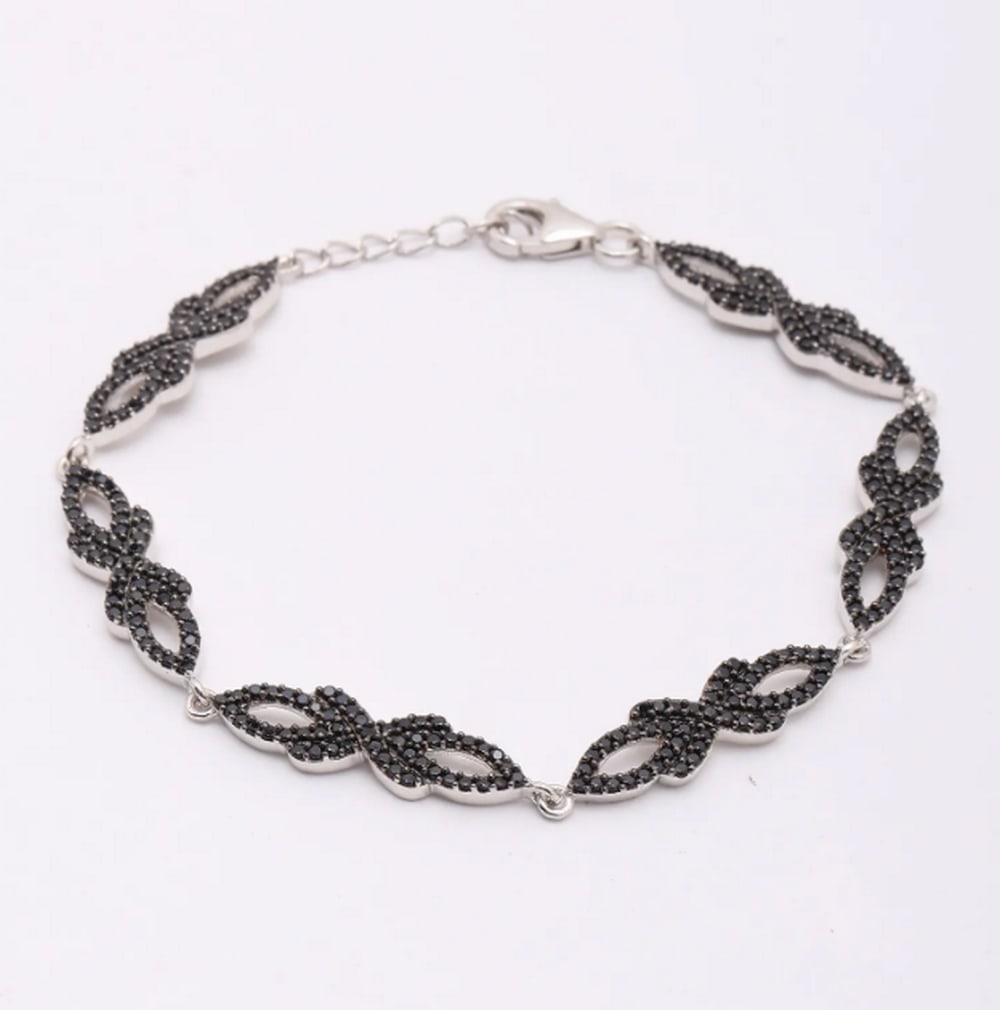 Midnight Spark Black Spinel Bracelet: Midnight Spark Black Spinel Bracelet Elevate your style with this sterling silver bracelet, featuring a striking arrangement of black spinel gemstones. The dark sparkle of each stone contrasts