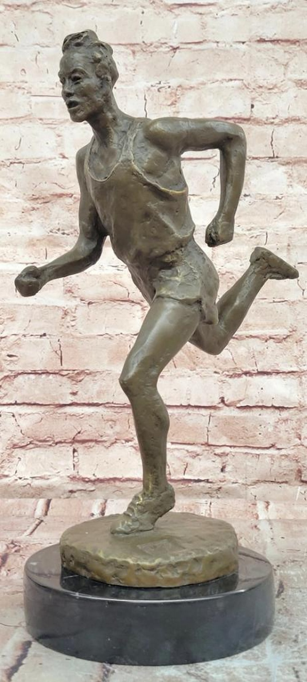 Male Running Man Bronze Sculpture by Milo - 16" x 10": Male Running Man Bronze Sculpture by Milo - 16" x 10" This signed original Milo bronze sculpture captures the speed and determination of a runner in full stride, expressed through a forward-le