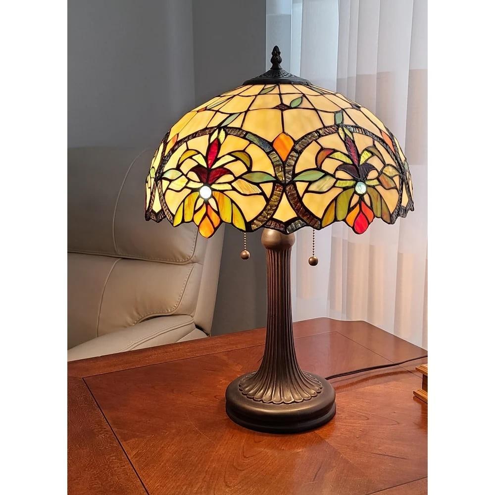 Tiffany Style Floral Stained Glass Table Lamp in Tan & Orange: Tiffany Style Floral Stained Glass Table Lamp in Tan & Orange Add warmth and timeless elegance to your space with this Tiffany Style Floral Stained Glass Table Lamp. The handcrafted shade features