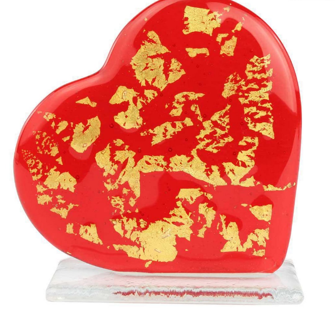 Red Heart of Gold – Murano Glass Love Sculpture: Red Heart of Gold – Murano Glass Love Sculpture This exclusive glass artwork is handcrafted using the fused glass technique, featuring a glass heart adorned with a smaller heart made from 24-carat g