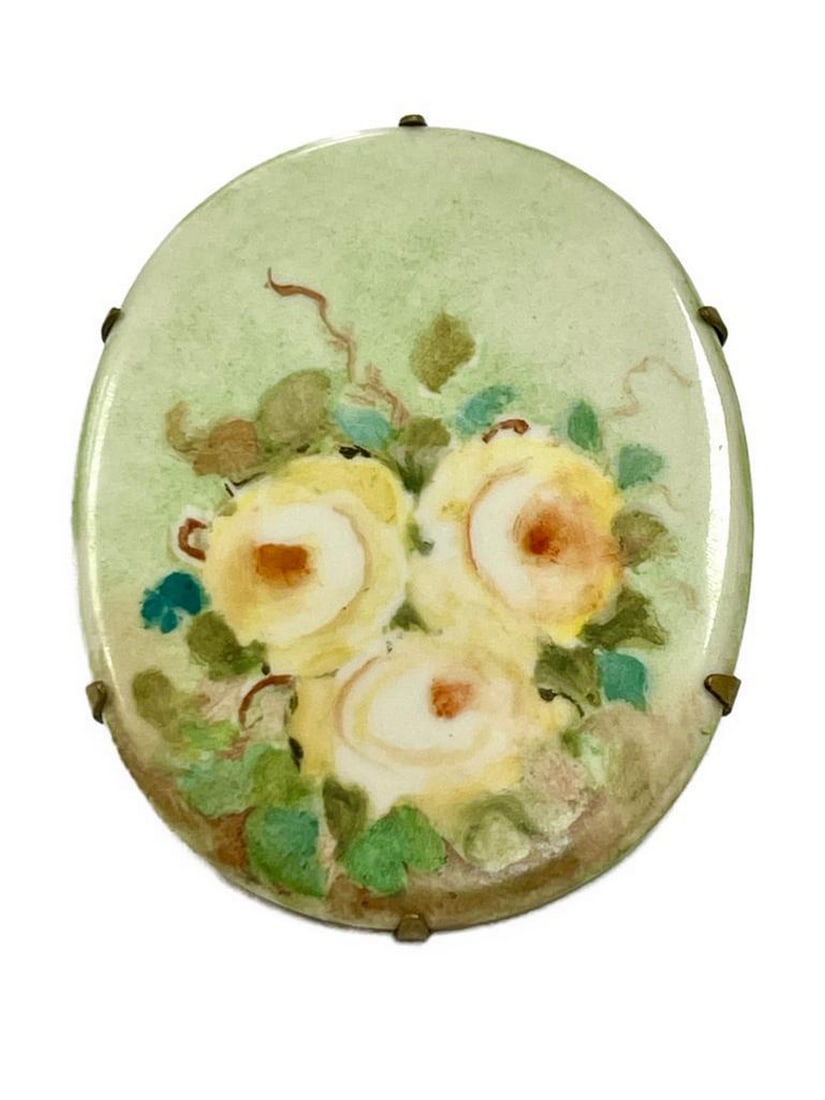 Vintage Porcelain Hand-Painted Floral Elegance Brooch: Vintage Porcelain Hand-Painted Floral Elegance Brooch Transport yourself to a bygone era of timeless sophistication with our Vintage Porcelain Hand-Painted Floral Elegance Brooch. This exquisite