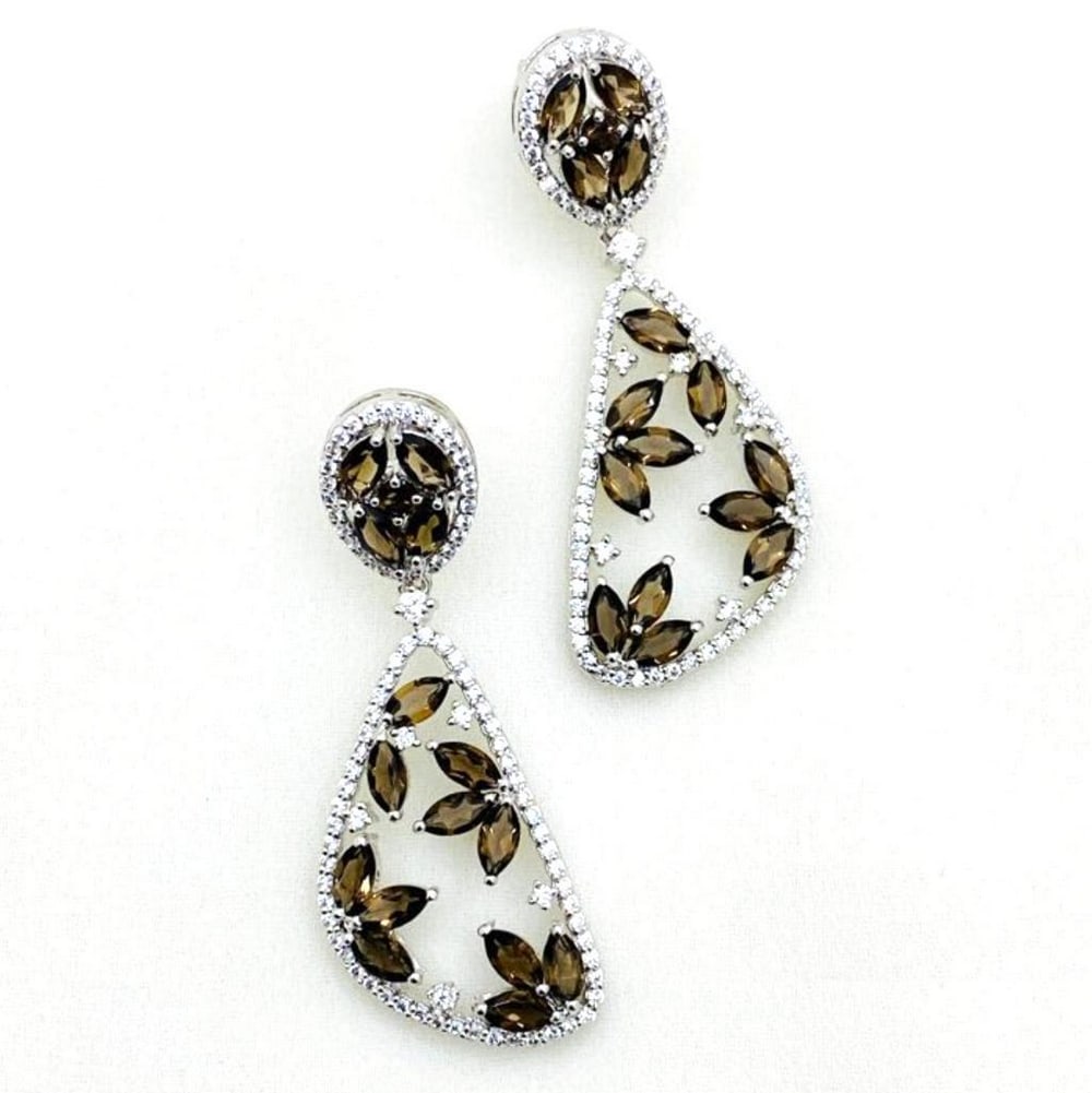 Smoky Quartz Leaf Clear Earrings: Smoky Quartz Leaf Clear Earrings These gorgeous earrings feature smoky quartz brown leaves with small zirconias outlining the earring and placed at the top of each leaf. View Photos For Further Detail