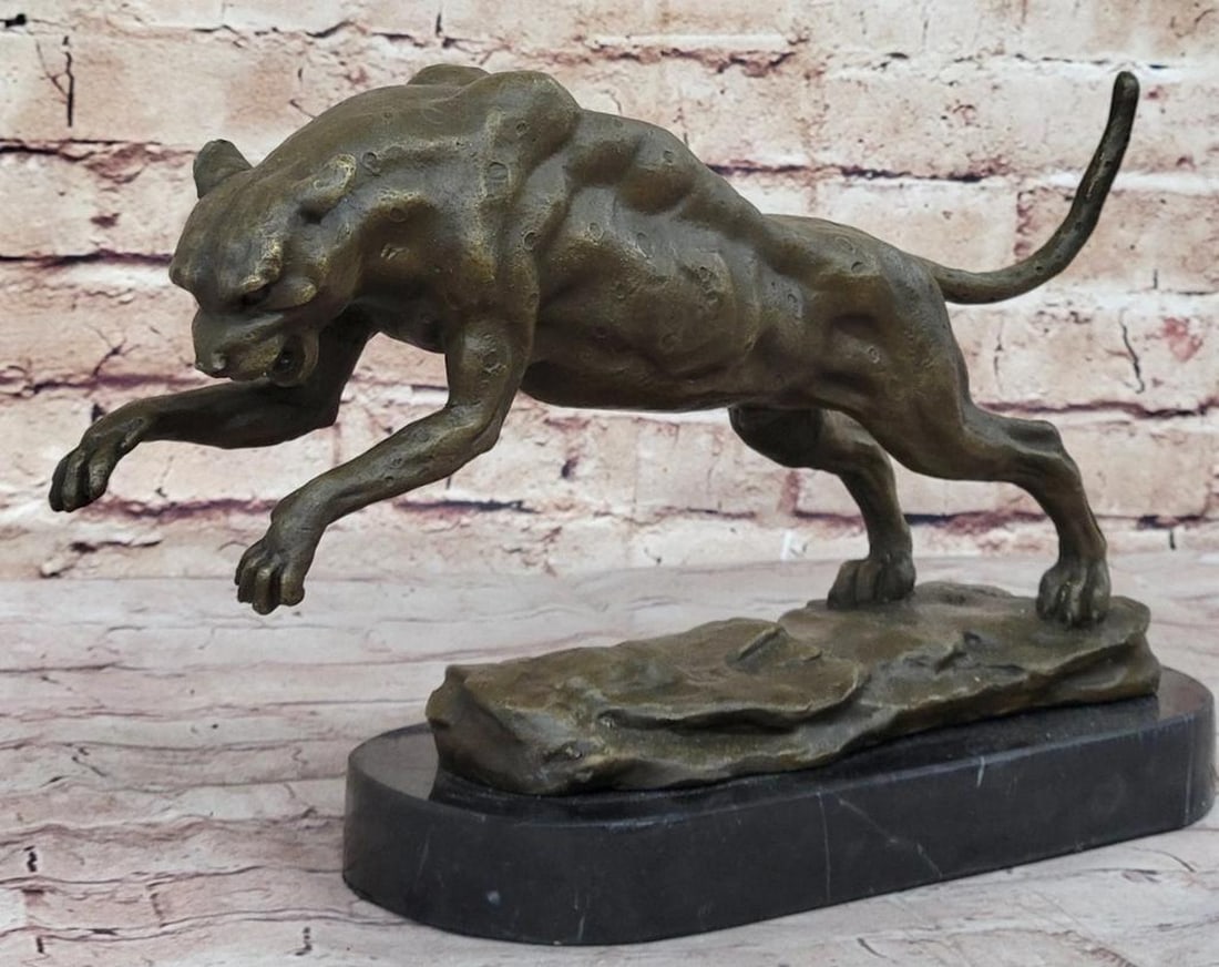 Leopard in Pursuit Bronze Sculpture by Bugatti - 10" x 14": Leopard in Pursuit Bronze Sculpture by Bugatti - 10" x 14" Immerse yourself in the untamed jungle with this striking bronze sculpture of a leopard scaling a tree, poised to defend his territor