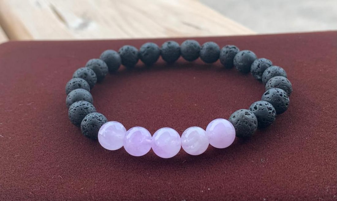 Lilac Aura Energy Bracelet: Lilac Aura Energy Bracelet Soft lavender amethyst beads meet the raw texture of black lava stones in this calming yet grounding bracelet. The gentle purple tones of amethyst are known to promote