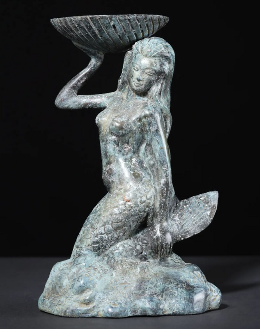 Brass Mermaid with Tealight Holder – 8": Brass Mermaid with Tealight Holder – 8" An 8-inch brass statue of a mermaid crafted using the lost wax technique. The figure features detailed incised lines across her scaled body, flowing