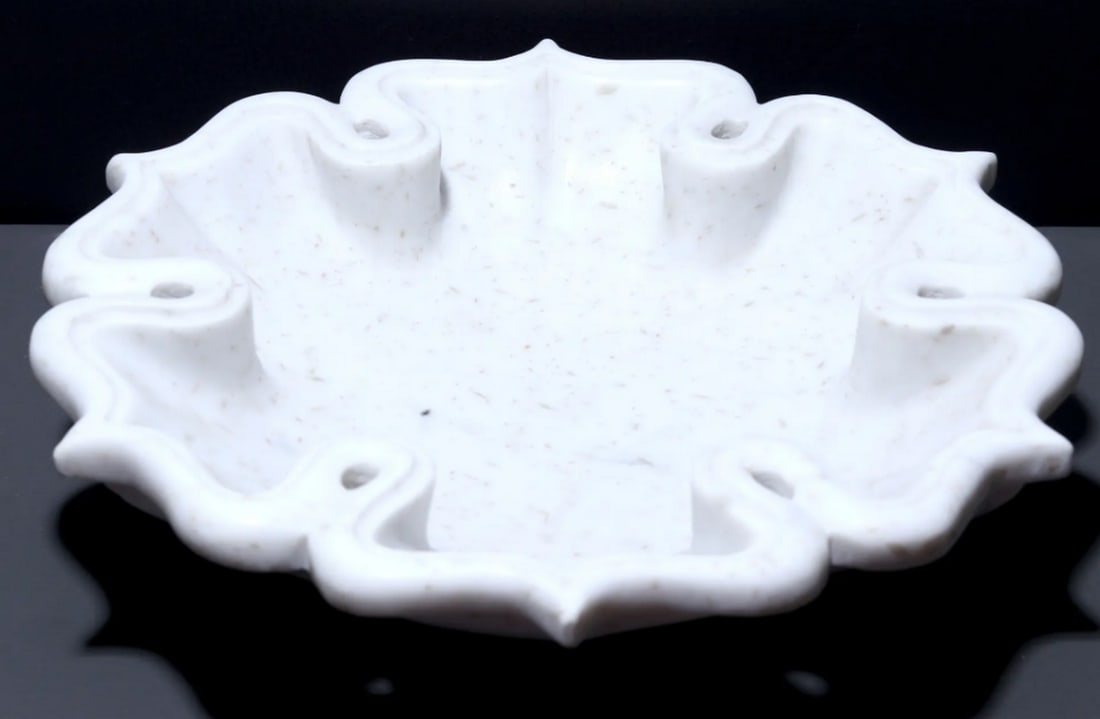 12" Stylish White Marble Urli: 12" Stylish White Marble Urli White marble urli with a granular texture, inspired by the lotus flower. Handcrafted by skilled artisans, it combines elegance and durability, making it suitable for 