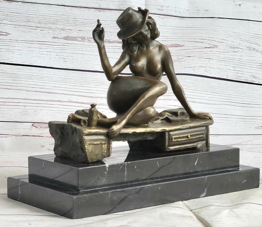 Handmade Classic Flapper Jazz Woman Bronze Sculpture - 8" x 9": Handmade Classic Flapper Jazz Woman Bronze Sculpture - 8" x 9" With style, grace and ease she leans back while she is laying seductively on a bench, wearing her lover`s hat and holding a c