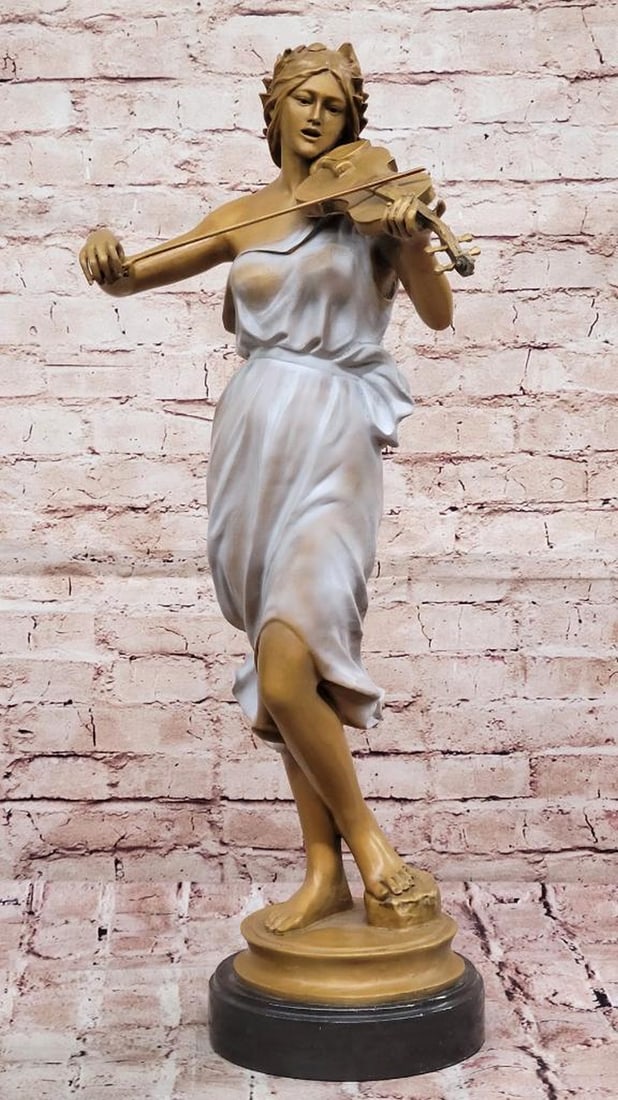 The Violinist’s Muse Bronze: The Violinist’s Muse Bronze The Violinist’s Muse is a stunning bronze-copper sculpture that captures the poise and passion of a woman immersed in her music. With her violin delicately cradled, she