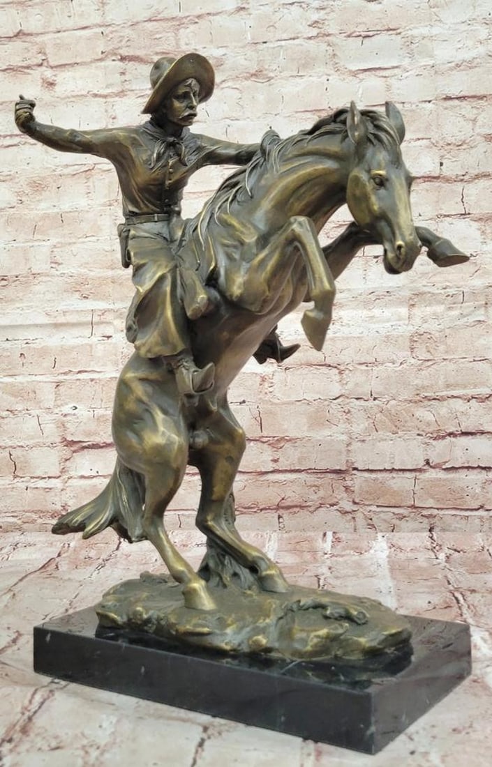 Bronco Buster Bronze Sculpture by Frederic Remington - 17" x 11.5": Bronco Buster Bronze Sculpture by Frederic Remington - 17" x 11.5" This dynamic bronze sculpture by Frederic Remington captures the raw energy of a cowboy taming a wild bronco, a timeless trib