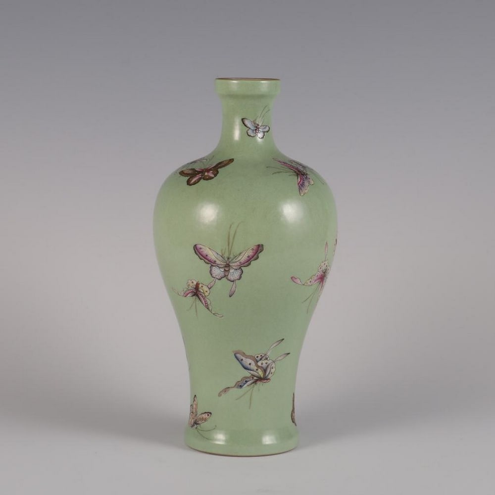 Qing Dynasty Yongzheng-Inspired Apple Green Famille Rose Plum Bottle with Butterfly Pattern: Qing Dynasty Yongzheng-Inspired Apple Green Famille Rose Plum Bottle with Butterfly Pattern An inspired plum-shaped porcelain bottle in the style of the Yongzheng period (1723–1735) of the Qing Dyna