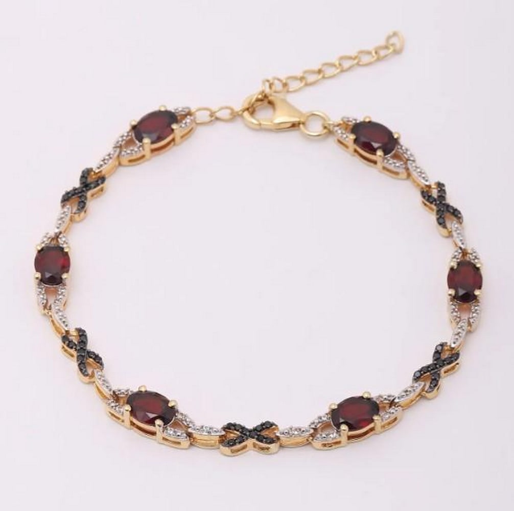 Scarlet Spark Gemstone Bracelet: Scarlet Spark Gemstone Bracelet A striking union of rich crimson and radiant sparkle, this bracelet features faceted garnet gemstones paired with dazzling white topaz. Each stone is precisely cut to